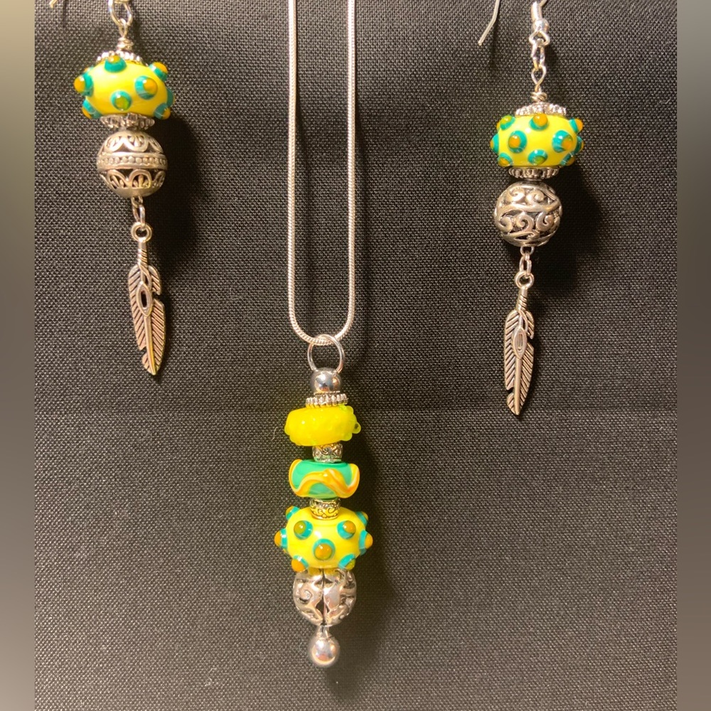 Uniquely designed hand crafted lamp work bead pendant with matching accessories